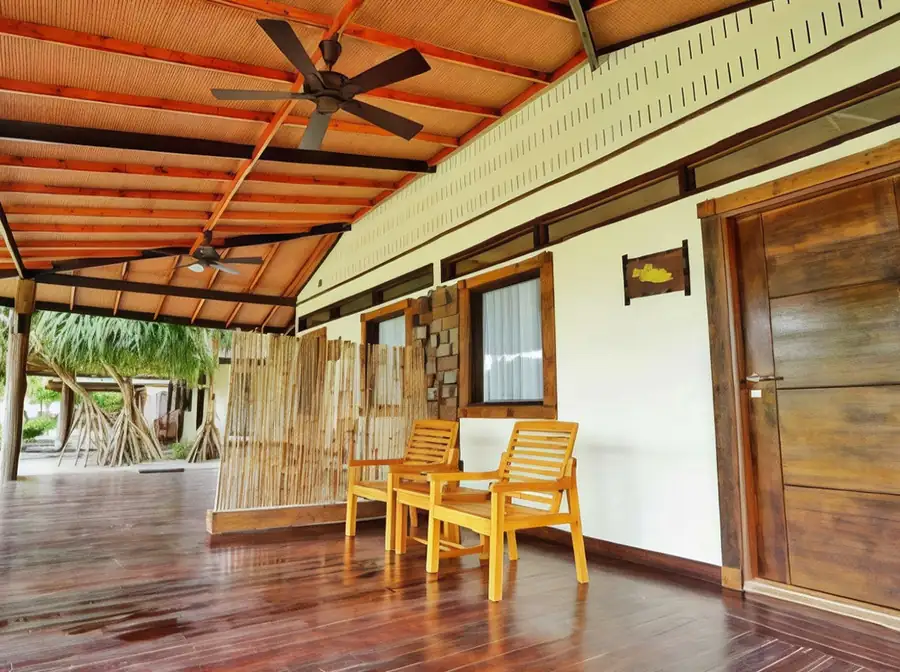 Private sunlit terrace offering a peaceful garden outlook at Mussah Poteh Resort