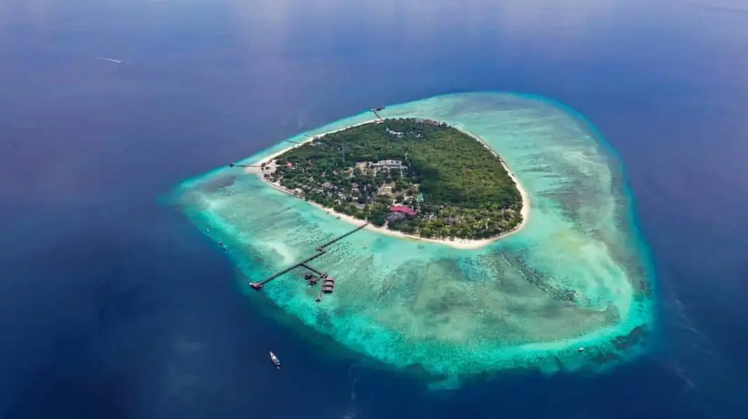 High angle drone shot of the overwater resort layout Mussah Poteh Resort