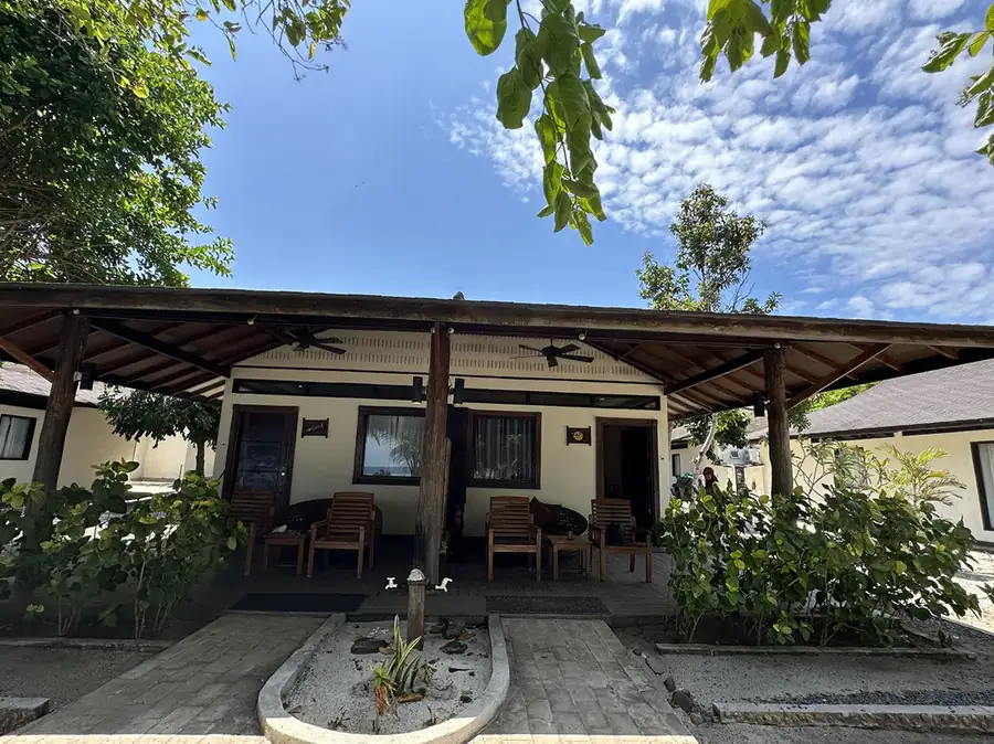 An overwater bungalow featuring white walls and a sloped roof at Mussah Poteh Resort